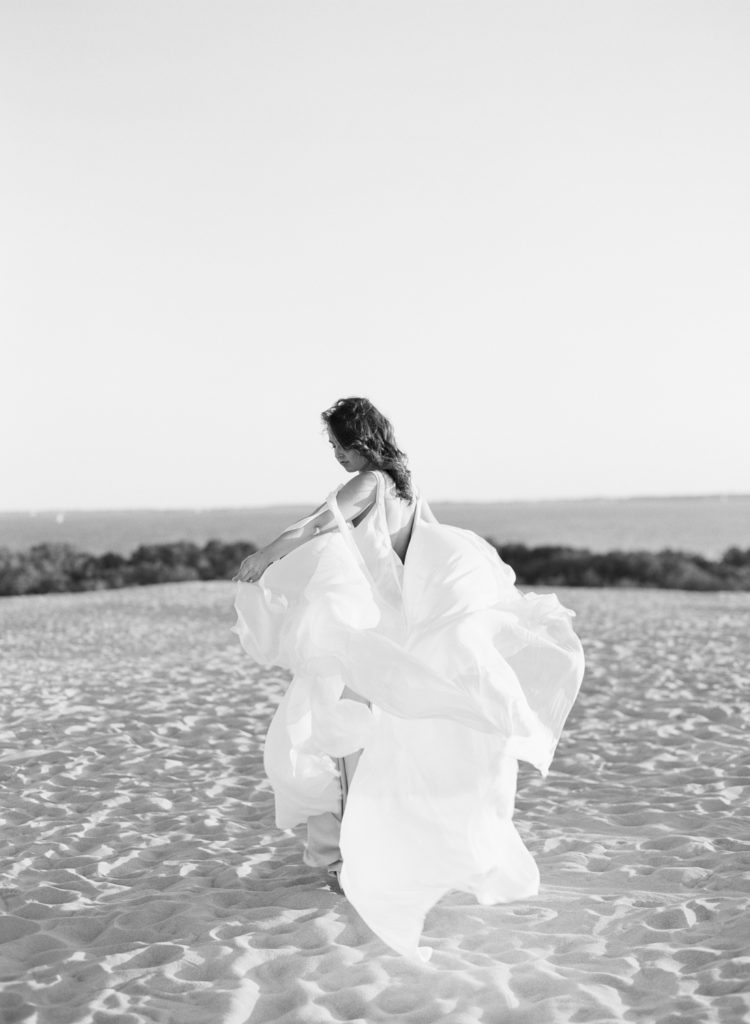 Beach wedding - bride with flowy gown on the beach
